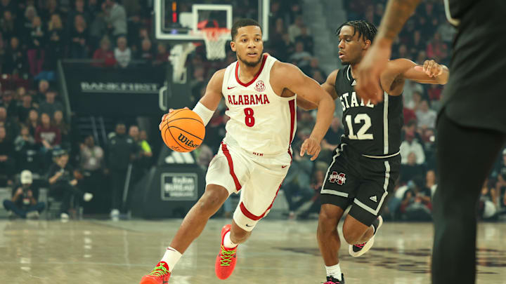 Jan 29, 2025; Starkville, Mississippi, USA; Alabama Crimson Tide guard Chris Youngblood (8) drives to the basket against Mississippi State Bulldogs guard Josh Hubbard (12) during the first half at Humphrey Coliseum. Mandatory Credit: Wesley Hale-Imagn Images Jan 29, 2025; Starkville, Mississippi, USA; Alabama Crimson Tide guard Chris Youngblood (8) drives to the basket against Mississippi State Bulldogs guard Josh Hubbard (12) during the first half at Humphrey Coliseum. Mandatory Credit: Wesley Hale-Imagn Images