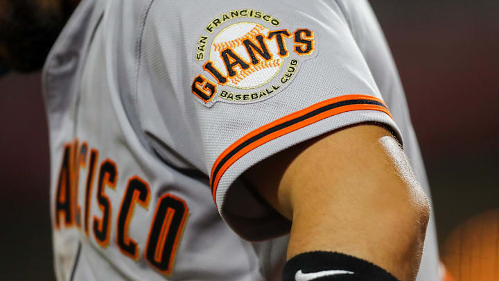 Jul 18, 2023; Cincinnati, Ohio, USA; The San Francisco Giants logo on the sleeve of right fielder Michael Conforto (8) during the fifth inning against the Cincinnati Reds at Great American Ball Park. Mandatory Credit: Katie Stratman-Imagn Images Jul 18, 2023; Cincinnati, Ohio, USA; The San Francisco Giants logo on the sleeve of right fielder Michael Conforto (8) during the fifth inning against the Cincinnati Reds at Great American Ball Park. Mandatory Credit: Katie Stratman-Imagn Images