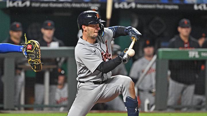 May 8, 2026; Kansas City, Missouri, USA;  Detroit Tigers shortstop Zack Short (15) attempts to lay down a bunt in the ninth inning against the Kansas City Royals at Kauffman Stadium. Mandatory Credit: Peter Aiken-Imagn Images