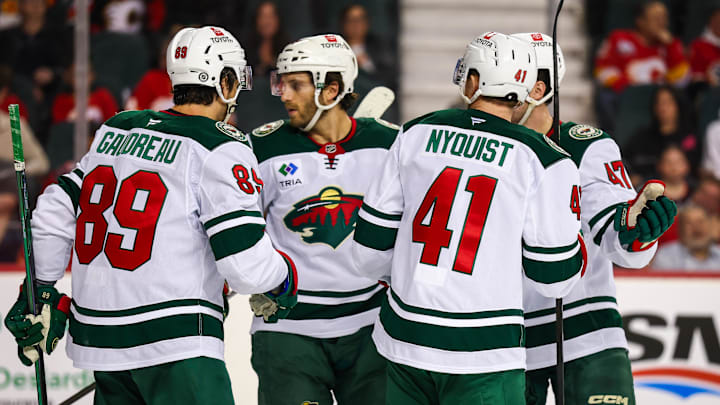 Apr 11, 2025; Calgary, Alberta, CAN; Minnesota Wild center Gustav Nyquist (41) celebrates his goal with teammates against the Calgary Flames during the third period at Scotiabank Saddledome. Mandatory Credit: Sergei Belski-Imagn Images
