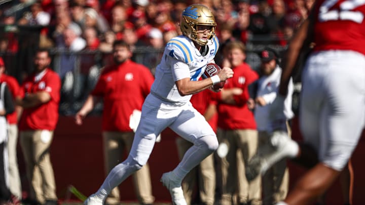 Oct 19, 2024; Piscataway, New Jersey, USA; UCLA Bruins quarterback Ethan Garbers (4) rushes for a touchdown during the first half against the Rutgers Scarlet Knights at SHI Stadium. Mandatory Credit: Vincent Carchietta-Imagn Images