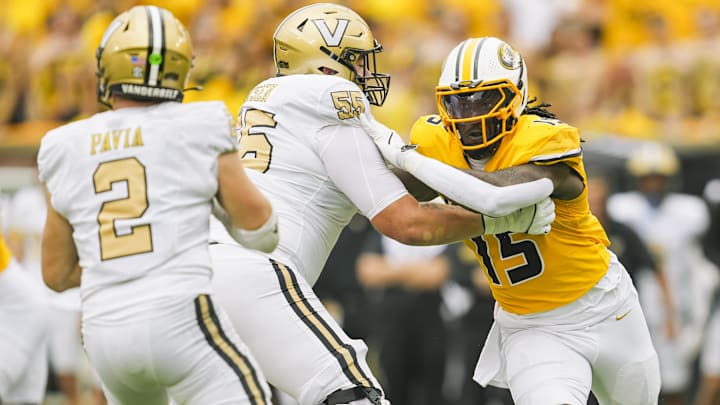 Sep 21, 2024; Columbia, Missouri, USA; Missouri Tigers defensive end Johnny Walker Jr. (15) rushes the quarterback against Vanderbilt Commodores offensive lineman Gunnar Hansen (55) and quarterback Diego Pavia (2) during the first half at Faurot Field at Memorial Stadium. Mandatory Credit: Jay Biggerstaff-Imagn Images