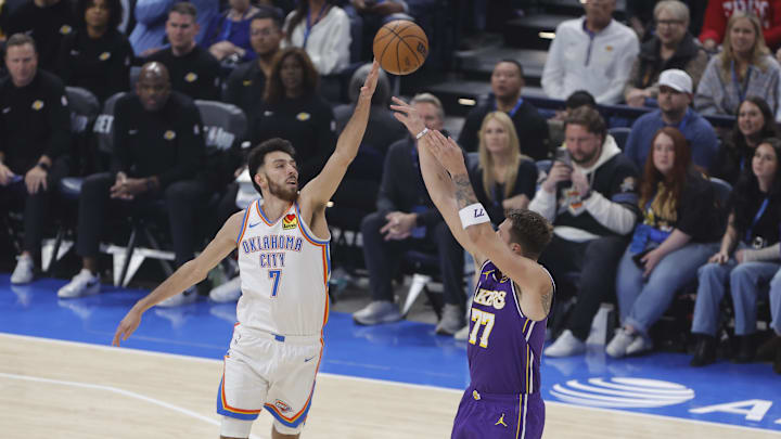 Nov 12, 2025; Oklahoma City, Oklahoma, USA; Oklahoma City Thunder center Chet Holmgren (7) defends a shot by Los Angeles Lakers guard Luka Doncic (77) during the first quarter at Paycom Center. Mandatory Credit: Alonzo Adams-Imagn Images