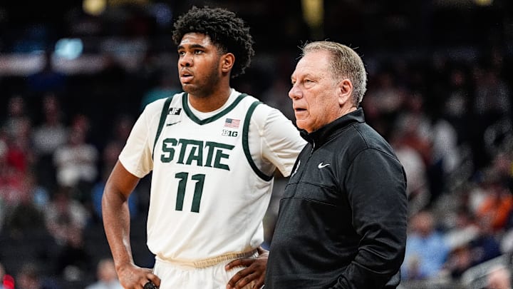 Michigan State guard Jase Richardson (11) watches a play against Oregon next to head coach Tom Izzo during the second half of Big Ten Tournament quarterfinal at Gainbridge Fieldhouse in Indianapolis, Ind. on Friday, March 14, 2025.