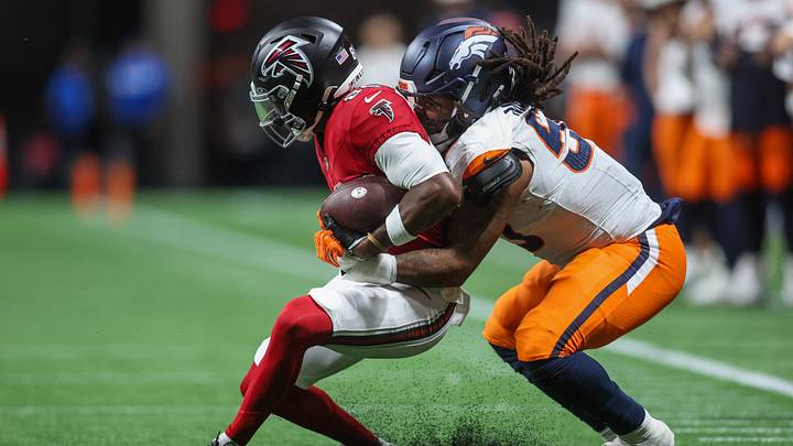 Atlanta Falcons wide receiver Keelan Marion (85) is tackled by Denver Broncos linebacker Red Murdock (50) in the second quater at Mercedes-Benz Stadium. 