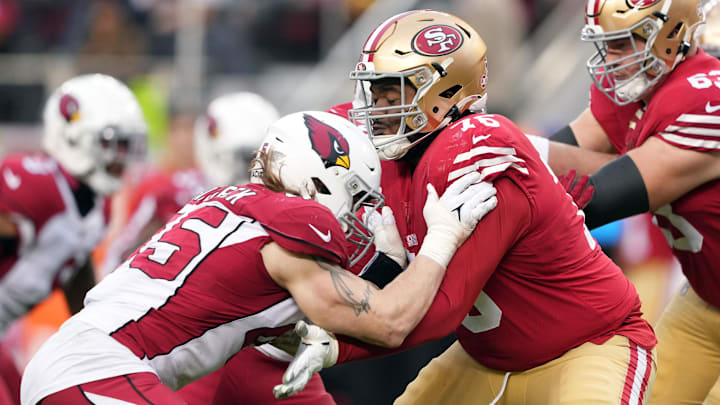 Jan 8, 2023; Santa Clara, California, USA; San Francisco 49ers guard Jaylon Moore (76) blocks Arizona Cardinals linebacker Dennis Gardeck (45) during the fourth quarter at Levi's Stadium. Mandatory Credit: Darren Yamashita-Imagn Images