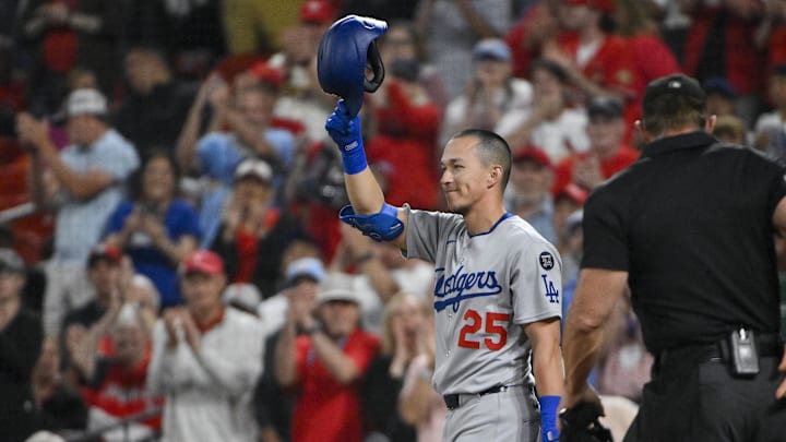 Jun 6, 2025; St. Louis, Missouri, USA;  Los Angeles Dodgers second baseman Tommy Edman (25) salutes the fans as he receives a standing ovation in his return to St. Louis before his first at bat against the St. Louis Cardinals at Busch Stadium. Mandatory Credit: Jeff Curry-Imagn Images