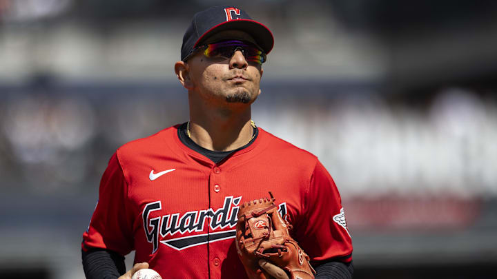 Apr 14, 2024; Cleveland, Ohio, USA; Cleveland Guardians second baseman Andres Gimenez (0) heads back to the dugout following the third out of the fifth inning against the New York Yankees at Progressive Field. Mandatory Credit: Scott Galvin-Imagn Images