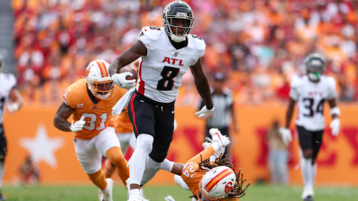Oct 27, 2024; Tampa, Florida, USA;Atlanta Falcons tight end Kyle Pitts (8) holds off Tampa Bay Buccaneers cornerback Tyrek Funderburk (24) in the second quarter  at Raymond James Stadium. Mandatory Credit: Nathan Ray Seebeck-Imagn Images