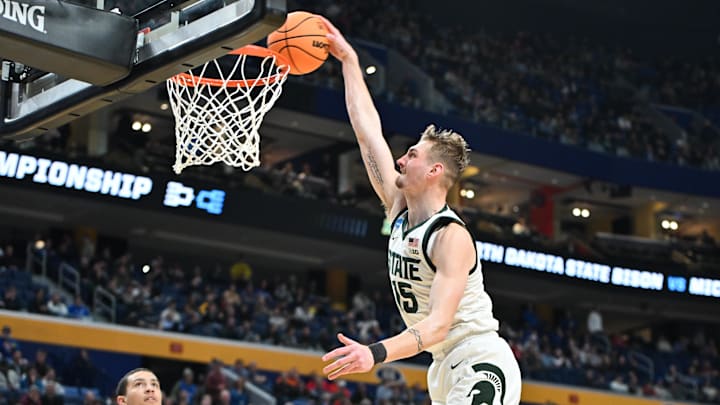 Mar 19, 2026; Buffalo, NY, USA; Michigan State Spartans center Carson Cooper (15) dunks during the second half against the North Dakota State Bison during a first round game of the men's 2026 NCAA Tournament at Keybank Center. Mandatory Credit: Mark Konezny-Imagn Images