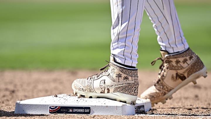 Mar 28, 2024; San Diego, California, USA; A detailed view of the shoes worn by San Diego Padres right fielder Fernando Tatis Jr. (23) in honor of former Padres chairman Peter Seidler during the sixth inning against the San Francisco Giants at Petco Park. Mandatory Credit: Orlando Ramirez-Imagn Images