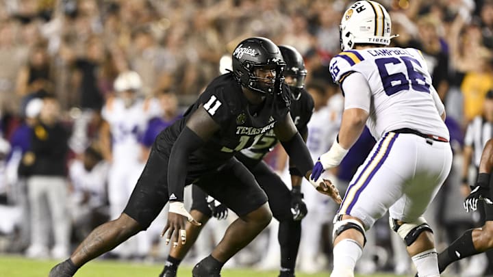 Oct 26, 2024; College Station, Texas, USA; Texas A&M Aggies defensive lineman Nic Scourton (11) defends in coverage against LSU Tigers offensive tackle Will Campbell (66) during the fourth quarter. The Aggies defeated the Tigers 38-23; at Kyle Field. Mandatory Credit: Maria Lysaker-Imagn Images.  