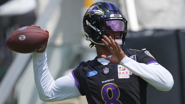 Jul 23, 2025; Owings Mills, MD, USA; Baltimore Ravens quarterback Lamar Jackson (8) warms up during training camp at Under Armour Performance Center. Mandatory Credit: Mitch Stringer-Imagn Images