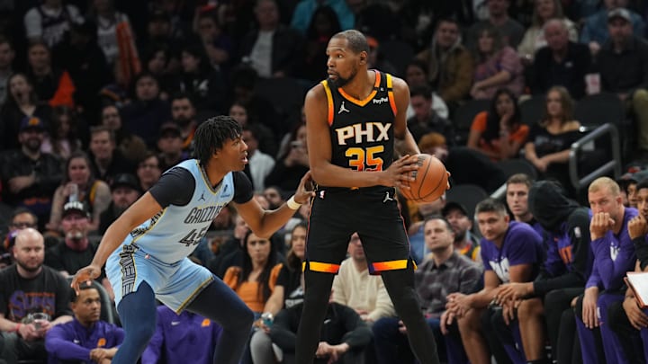 Feb 11, 2025; Phoenix, Arizona, USA; Memphis Grizzlies forward GG Jackson (45) guards Phoenix Suns forward Kevin Durant (35) during the second half at Footprint Center. Mandatory Credit: Joe Camporeale-Imagn Images