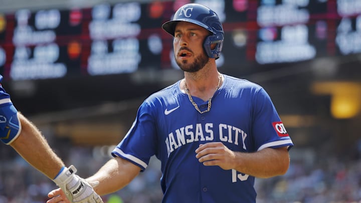 Aug 14, 2024; Minneapolis, Minnesota, USA; Kansas City Royals third baseman Paul DeJong (15) celebrates after scoring a run against the Minnesota Twins in the second inning at Target Field.