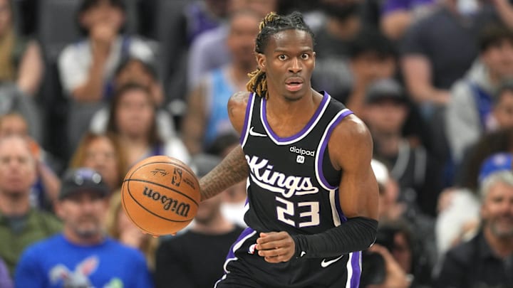 Mar 31, 2024; Sacramento, California, USA; Sacramento Kings guard Keon Ellis (23) dribbles against the Utah Jazz during the first quarter at Golden 1 Center. Mandatory Credit: Darren Yamashita-USA TODAY Sports