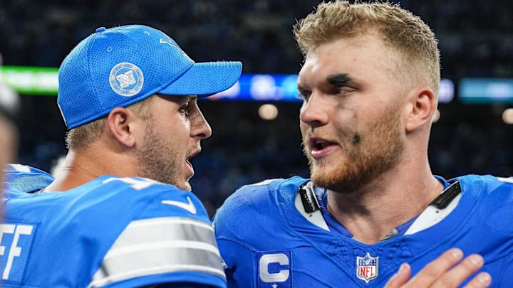 Detroit Lions quarterback Jared Goff (16) celebrates a 26-20 win over the Los Angeles Rams with defensive end Aidan Hutchinson (97) at Ford Field.