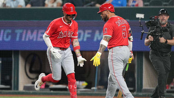 Aug 25, 2025; Arlington, Texas, USA; Los Angeles Angels shortstop Zach Neto (9) celebrates his solo home run with third baseman Yoan Moncada (5) against the Texas Rangers during the first inning at Globe Life Field. Mandatory Credit: Jim Cowsert-Imagn Images