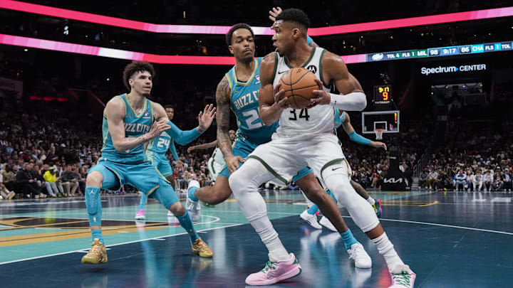 Nov 17, 2023; Charlotte, North Carolina, USA; Milwaukee Bucks forward Giannis Antetokounmpo (34) drives to the basket against Charlotte Hornets forward P.J. Washington (25) and guard LaMelo Ball (1) during the second half at the Spectrum Center. Mandatory Credit: Jim Dedmon-Imagn Images Nov 17, 2023; Charlotte, North Carolina, USA; Milwaukee Bucks forward Giannis Antetokounmpo (34) drives to the basket against Charlotte Hornets forward P.J. Washington (25) and guard LaMelo Ball (1) during the second half at the Spectrum Center. Mandatory Credit: Jim Dedmon-Imagn Images