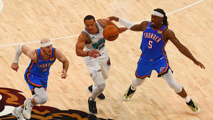 Apr 24, 2025; Memphis, Tennessee, USA; Oklahoma City Thunder guard Alex Caruso (9) and guard Luguentz Dort (5) steal the ball from Memphis Grizzlies guard Desmond Bane (22) during the fourth quarter during game three for the first round of the 2024 NBA Playoffs at FedExForum. Mandatory Credit: Petre Thomas-Imagn Images Apr 24, 2025; Memphis, Tennessee, USA; Oklahoma City Thunder guard Alex Caruso (9) and guard Luguentz Dort (5) steal the ball from Memphis Grizzlies guard Desmond Bane (22) during the fourth quarter during game three for the first round of the 2024 NBA Playoffs at FedExForum. Mandatory Credit: Petre Thomas-Imagn Images