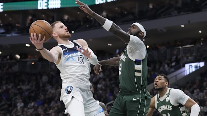 Apr 8, 2025; Milwaukee, Wisconsin, USA; Milwaukee Bucks guard Damian Lillard (0) drives to the basket against Milwaukee Bucks forward Bobby Portis (9) in the first half at Fiserv Forum. Mandatory Credit: Michael McLoone-Imagn Images Apr 8, 2025; Milwaukee, Wisconsin, USA; Milwaukee Bucks guard Damian Lillard (0) drives to the basket against Milwaukee Bucks forward Bobby Portis (9) in the first half at Fiserv Forum. Mandatory Credit: Michael McLoone-Imagn Images