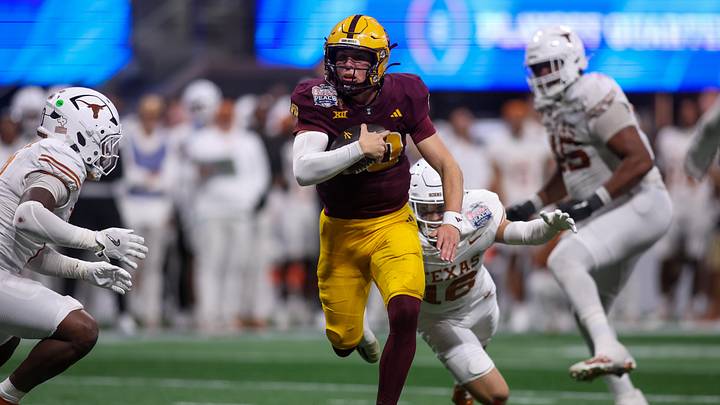 Sam Leavitt scrambles away from defenders in the 2024 College Football Playoff Sam Leavitt scrambles away from defenders in the 2024 College Football Playoff