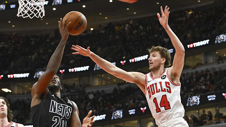 Dec 2, 2024; Chicago, Illinois, USA;  Brooklyn Nets center Day'Ron Sharpe (20) shoots against Chicago Bulls forward Matas Buzelis (14) 