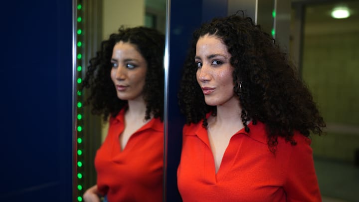 TV presenter Tessniem Kadiri poses in an elevator