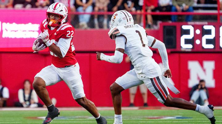 Sep 12, 2026; Lincoln, Nebraska, USA; Nebraska Cornhuskers running back Isaiah Mozee (22) runs against Bowling Green Falcons defensive back Drey Braxton (1) during the second quarter at Memorial Stadium. Mandatory Credit: Dylan Widger-Imagn Images Sep 12, 2026; Lincoln, Nebraska, USA; Nebraska Cornhuskers running back Isaiah Mozee (22) runs against Bowling Green Falcons defensive back Drey Braxton (1) during the second quarter at Memorial Stadium. Mandatory Credit: Dylan Widger-Imagn Images