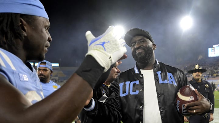 Nov 8, 2024; Pasadena, California, USA; UCLA Bruins head coach DeShaun Foster shakes hands with running back T.J. Harden (25) after defeating the Iowa Hawkeyes at the Rose Bowl. Mandatory Credit: Jayne Kamin-Oncea-Imagn Images Nov 8, 2024; Pasadena, California, USA; UCLA Bruins head coach DeShaun Foster shakes hands with running back T.J. Harden (25) after defeating the Iowa Hawkeyes at the Rose Bowl. Mandatory Credit: Jayne Kamin-Oncea-Imagn Images