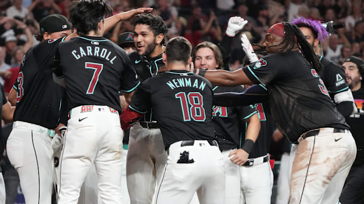 Aug 9, 2024; Phoenix, Arizona, USA; Arizona Diamondbacks catcher Adrian Del Castillo (25) celebrates with teammates after hitting a walk off solo home run against the Philadelphia Phillies in the ninth inning at Chase Field. Mandatory Credit: Rick Scuteri-Imagn Images Aug 9, 2024; Phoenix, Arizona, USA; Arizona Diamondbacks catcher Adrian Del Castillo (25) celebrates with teammates after hitting a walk off solo home run against the Philadelphia Phillies in the ninth inning at Chase Field. Mandatory Credit: Rick Scuteri-Imagn Images