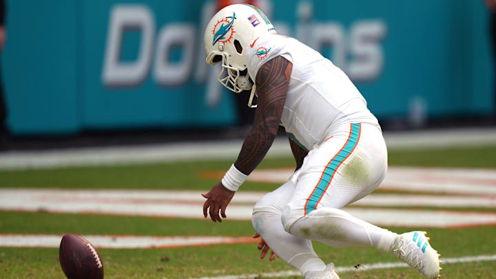 Oct 27, 2024; Miami Gardens, Florida, USA; Miami Dolphins quarterback Tua Tagovailoa (1) attempts to knock the ball out of the end zone after a safety against the Arizona Cardinals in the third quarter at Hard Rock Stadium. 