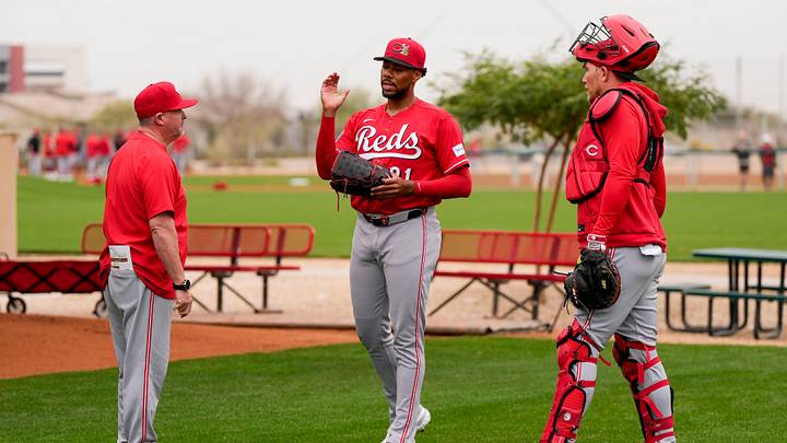 Cincinnati Reds pitching coach/director of pitching Derek Johnson (36) wraps up a bullpen session with pitcher Hunter Greene (21) at the Cincinnati Reds player development complex in Goodyear, Ariz., on Friday, Feb. 13, 2026. Cincinnati Reds pitching coach/director of pitching Derek Johnson (36) wraps up a bullpen session with pitcher Hunter Greene (21) at the Cincinnati Reds player development complex in Goodyear, Ariz., on Friday, Feb. 13, 2026.
