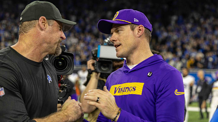 Jan 5, 2025; Detroit, Michigan, USA; Detroit Lions Head Coach Dan Campbell (L) shakes hands with Minnesota Vikings Head Coach Sean McDermott after the game at Ford Field.