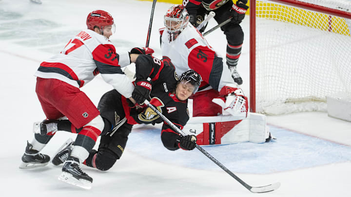 Apr 5, 2026; Ottawa, Ontario, CAN; Carolina Hurricanes right wing Andrei Svechnikov (37) takes Ottawa Senators center Tim Stutzle (18) off the puck in the third period at the Canadian Tire Centre. Mandatory Credit: Marc DesRosiers-IMAGN Images
