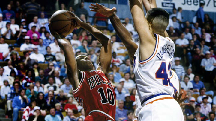 Unknown date 1993; Richfield, OH, USA; FILE PHOTO; Chicago Bulls guard B.J. Armstrong (10) is guarded by Cleveland Cavaliers center Brad Daugherty (43) at the Richfield Coliseum. Mandatory Credit: Imagn Images