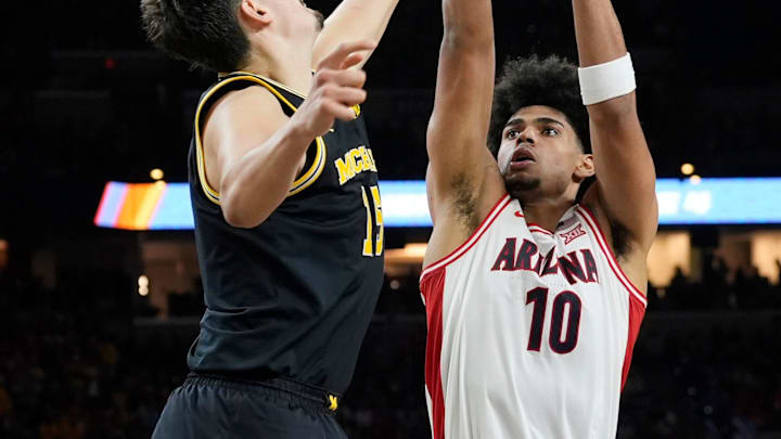 Michigan center Aday Mara (15) blocks Arizona forward Koa Peat (10) shot in the second half of their Final Four game at Lucas Oil Stadium in Indianapolis on Saturday, April 4, 2026.