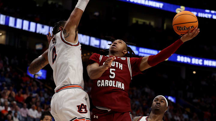 South Carolina Gamecocks guard Meechie Johnson (5) attempts a basket while being guarded by Auburn South Carolina Gamecocks guard Meechie Johnson (5) attempts a basket while being guarded by Auburn