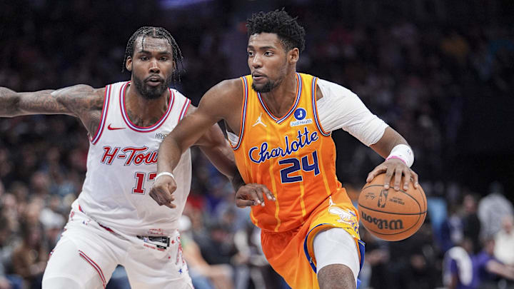 Feb 19, 2026; Charlotte, North Carolina, USA;  Charlotte Hornets forward Brandon Miller (24) goes to the basket defended by Houston Rockets forward Tari Eason (17) during the second  quarter at Spectrum Center. Mandatory Credit: Jim Dedmon-Imagn Images
