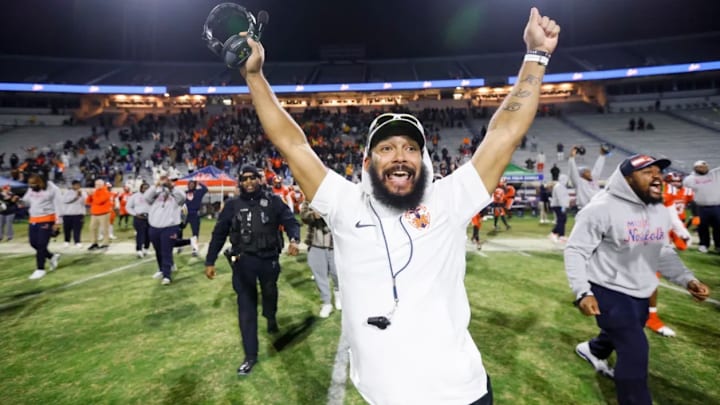 Maury High School Head Coach Dyrri McCain celebrates after their state title victory