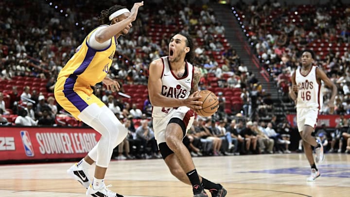 Jaylon Tyson of the Cleveland Cavaliers drives past Moses Brown at the Thomas & Mack Center.