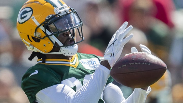 Former Green Bay Packers safety Tarvarius Moore (30) drops a pass during practice at Ray Nitschke Field. 
