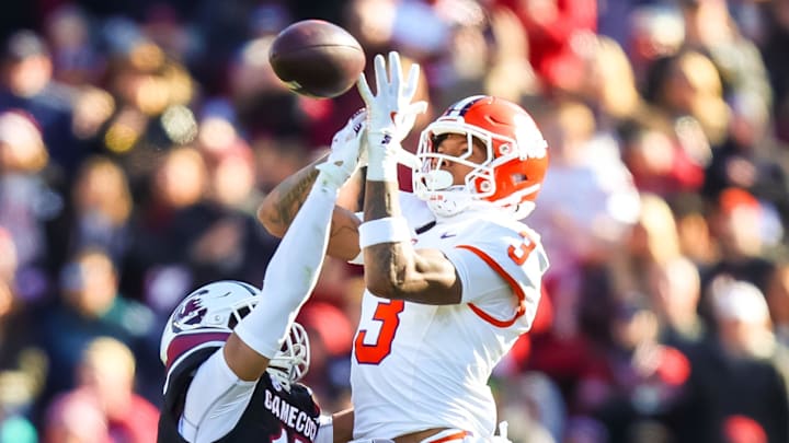 Nov 29, 2025; Columbia, South Carolina, USA; South Carolina Gamecocks cornerback Brandon Cisse (15) breaks up a pass intended for Clemson Tigers wide receiver Tristan Smith (3) in the third quarter at Williams-Brice Stadium. Mandatory Credit: Jeff Blake-Imagn Images