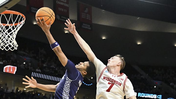 Mar 19, 2026; Portland, OR, USA; High Point Panthers guard Rob Martin (3) shoots against Wisconsin Badgers guard Andrew Rohde (7) during the second half of a first round game of the men's 2026 NCAA Tournament at Moda Center. Mandatory Credit: Craig Strobeck-Imagn Images Mar 19, 2026; Portland, OR, USA; High Point Panthers guard Rob Martin (3) shoots against Wisconsin Badgers guard Andrew Rohde (7) during the second half of a first round game of the men's 2026 NCAA Tournament at Moda Center. Mandatory Credit: Craig Strobeck-Imagn Images