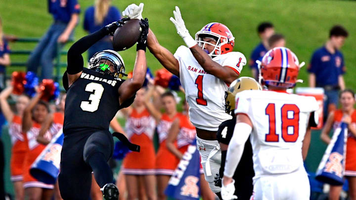 Abilene defensive back Jeremiah Collins intercepts a pass.