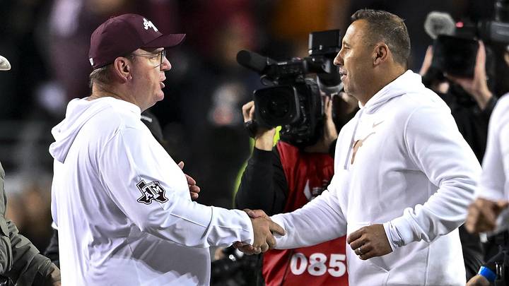 Nov 30, 2024; College Station, Texas, USA; Texas A&M Aggies head coach Mike Elko and Texas Longhorns head coach Steve Sarkisian