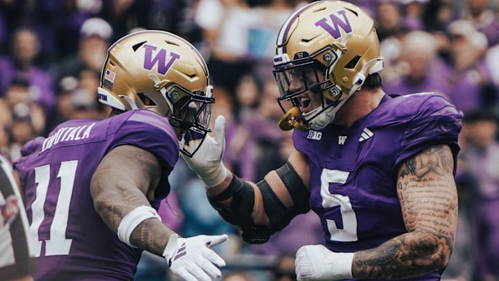 Alphonzo Tuputala and Zach Durfee celebrate a defensive stop. 