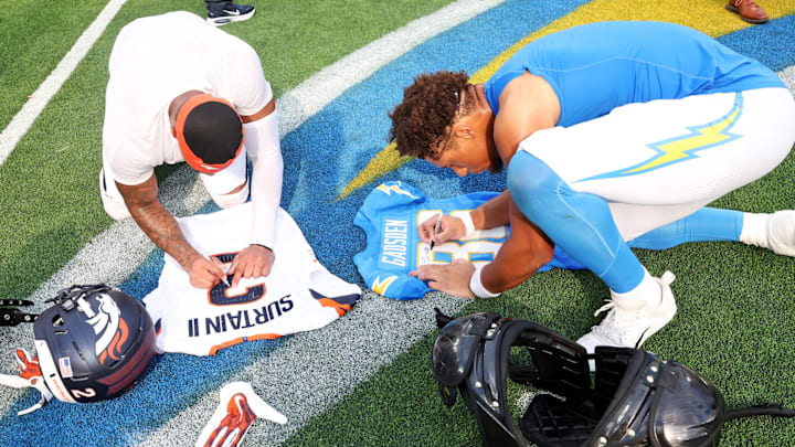 Two sons of former Miami Dolphins players, Denver Broncos cornerback Pat Surtain II (2) and Los Angeles Chargers tight end 