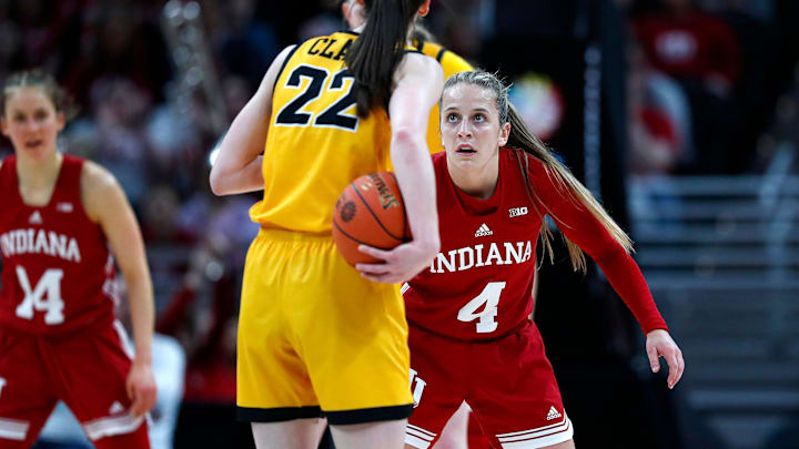 Indiana Hoosiers guard Nicole Cardano-Hillary (4) guards Iowa Hawkeyes guard Caitlin Clark (22) during the second quarter of the Big Ten women's championship game Sunday, March 6, 2022, at Gainbridge Fieldhouse in Indianapolis.