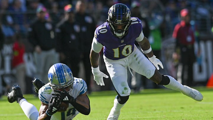 Oct 22, 2023; Baltimore, Maryland, USA; Detroit Lions wide receiver Amon-Ra St. Brown (14) dived to make a catch in front of Baltimore Ravens cornerback Arthur Maulet (10) during the first half at M&T Bank Stadium. Mandatory Credit: Tommy Gilligan-Imagn Images Oct 22, 2023; Baltimore, Maryland, USA; Detroit Lions wide receiver Amon-Ra St. Brown (14) dived to make a catch in front of Baltimore Ravens cornerback Arthur Maulet (10) during the first half at M&T Bank Stadium. Mandatory Credit: Tommy Gilligan-Imagn Images